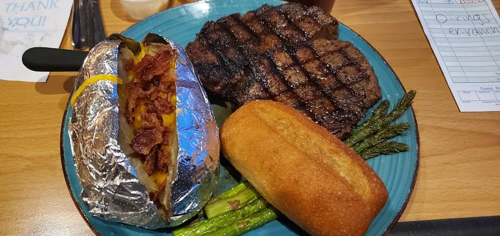 Delmonico Steak Loaded Baked Potato and Grilled Asparagus