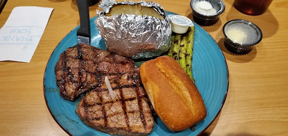 Delmonico Steak with Baked Potato and Grilled Asparagus