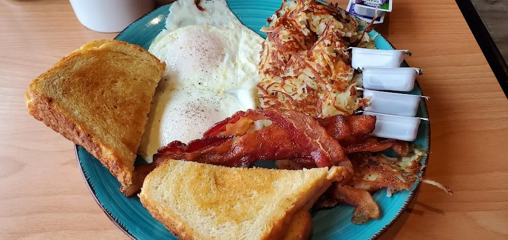 Eggs and Bacon with Hash Browns and Toast
