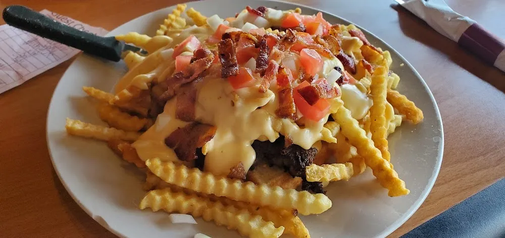 Pony Shoe with Added Onions Tomatoes and Bacon and White Cheese